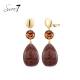 Oorclips | Ambersteen met bruine hanger | Goudkleurig detail