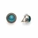 Oorclips met turquoise spiraal en bol glasdesign en een zilverkleurige rand