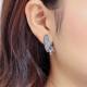 Grijze oorclips met kunsthars inleg en strass steen